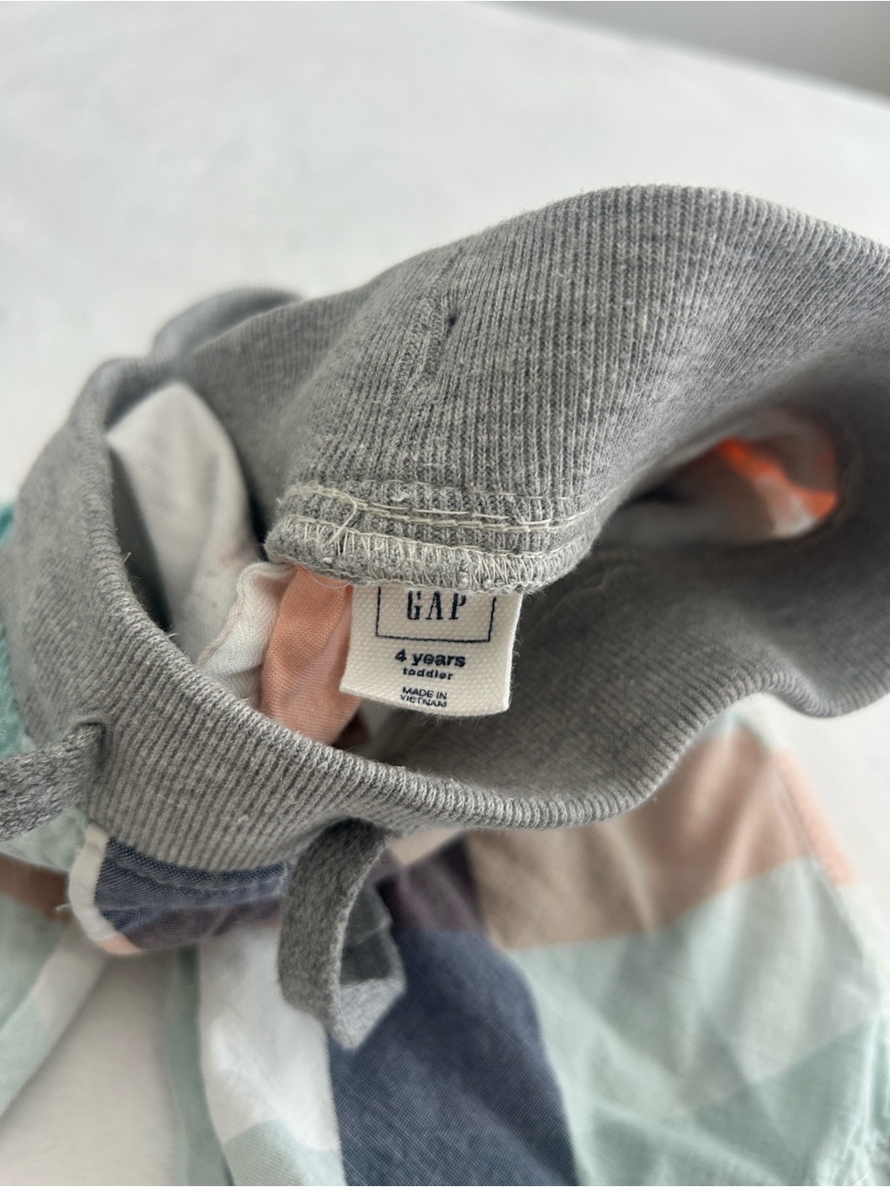 GAP Kids Drawstring Hat in Gray with Pastel Stripe Panels